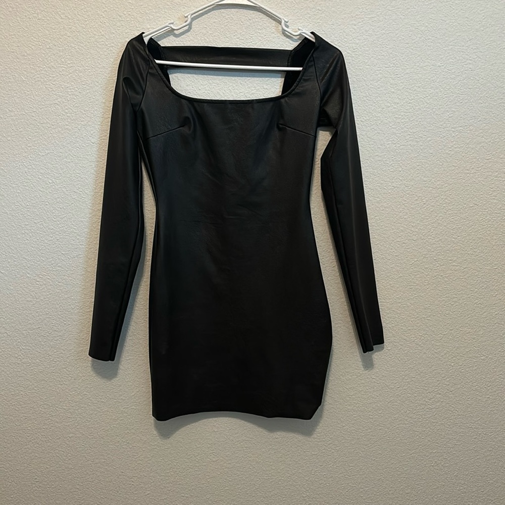 Never worn. New without tags Naked Wardrobe black leather like mini dress. Sz 0
